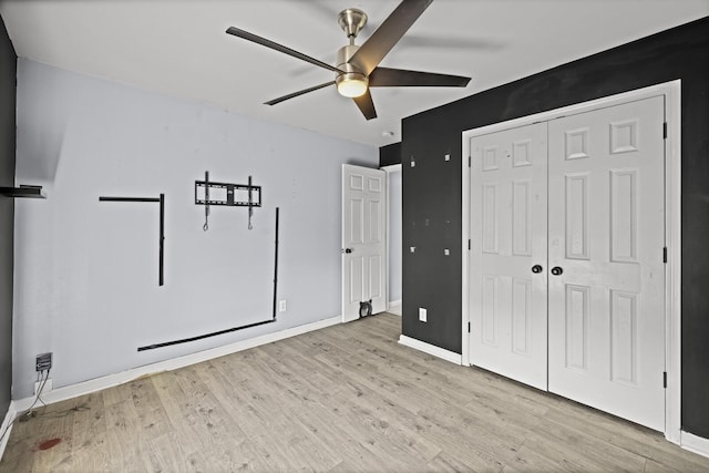 5009 Lanier Dr, Greenbrier, TN 37073 - unfurnished bedroom with wood finished floors, a closet, baseboards, and a ceiling fan