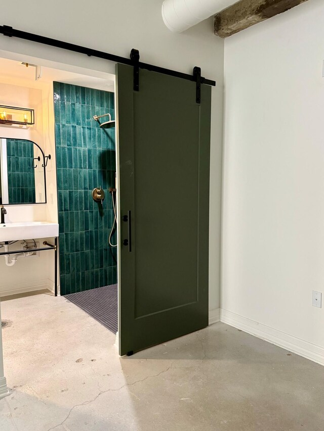 117 E 7th St Unit 207, Chattanooga, TN 37402 - full bathroom featuring tiled shower, vanity, and finished concrete floors