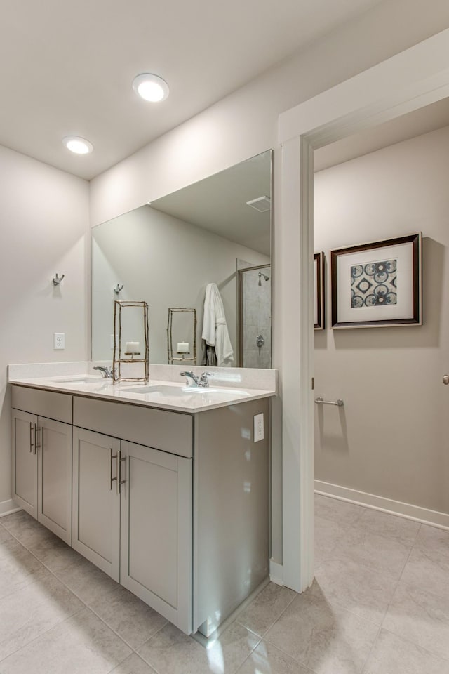 2413 Williams Ridge Dr, Columbia, TN 38401 - bathroom featuring double vanity, a shower stall, and baseboards