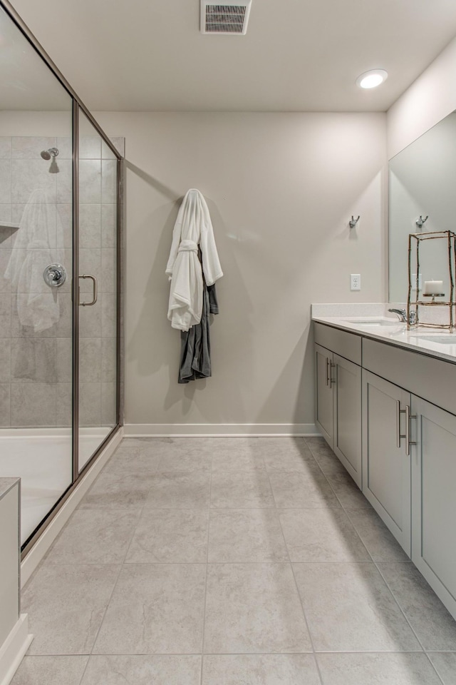 2413 Williams Ridge Dr, Columbia, TN 38401 - full bathroom featuring vanity, a shower stall, tile patterned floors, baseboards, and recessed lighting