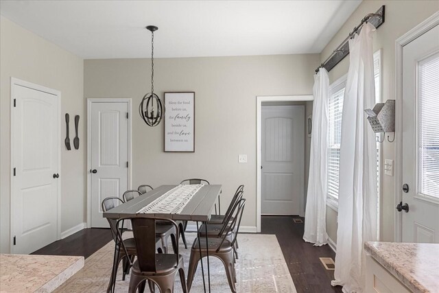 1020 Corey Dr, Lewisburg, TN 37091 - dining room with a chandelier, dark wood finished floors, and baseboards