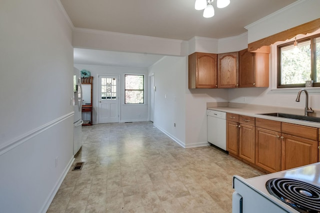 930 Havenhill Dr, Nashville, TN 37217 - kitchen featuring white appliances, a sink, brown cabinetry, ornamental molding, and baseboards