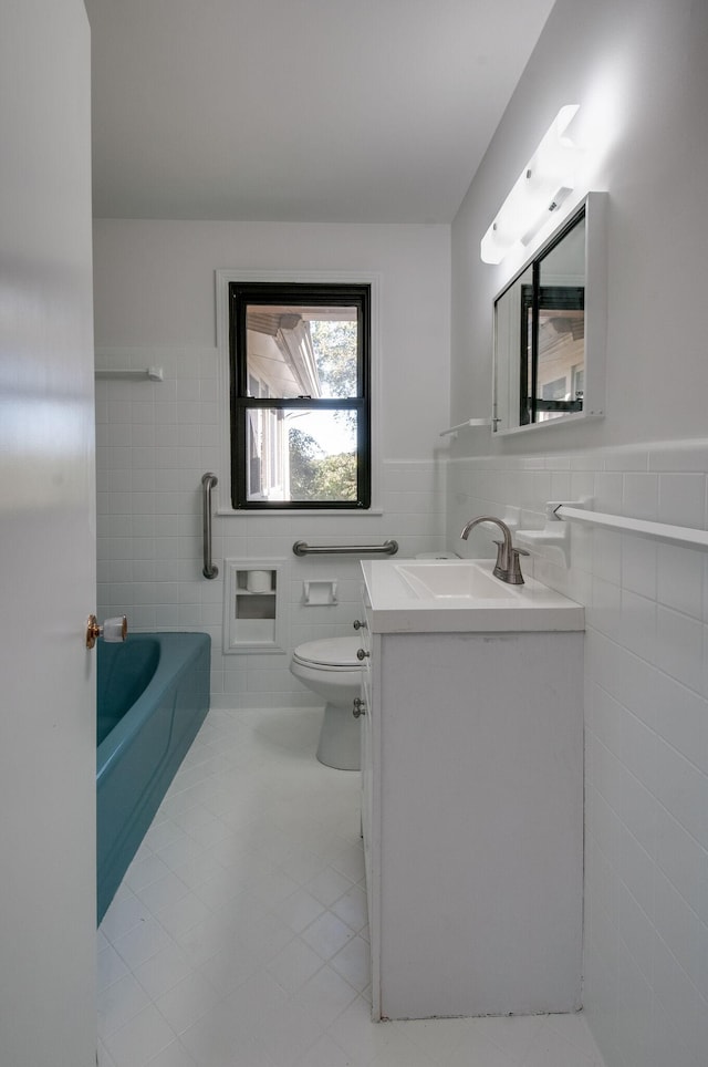 930 Havenhill Dr, Nashville, TN 37217 - full bathroom with tile walls, vanity, toilet, tile patterned floors, and a tub