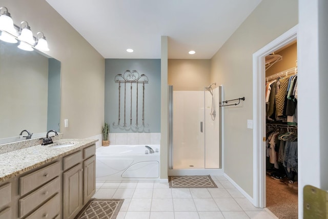 1513 Bunbury Dr, Thompsons Station, TN 37179 - bathroom featuring a shower stall, a garden tub, vanity, tile patterned flooring, and a walk in closet