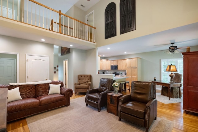 1513 Bunbury Dr, Thompsons Station, TN 37179 - living room with a high ceiling, light wood-style flooring, ceiling fan, and recessed lighting