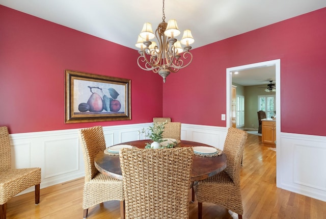 1513 Bunbury Dr, Thompsons Station, TN 37179 - dining space featuring a wainscoted wall, a chandelier, light wood-style flooring, and a decorative wall
