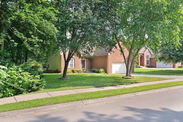 1513 Bunbury Dr, Thompsons Station, TN 37179 - obstructed view of property featuring brick siding, a front yard, and concrete driveway