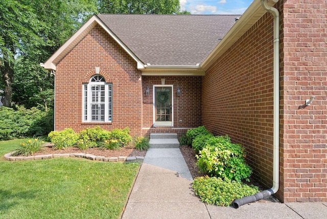 1513 Bunbury Dr, Thompsons Station, TN 37179 - property entrance with brick siding, roof with shingles, and a lawn