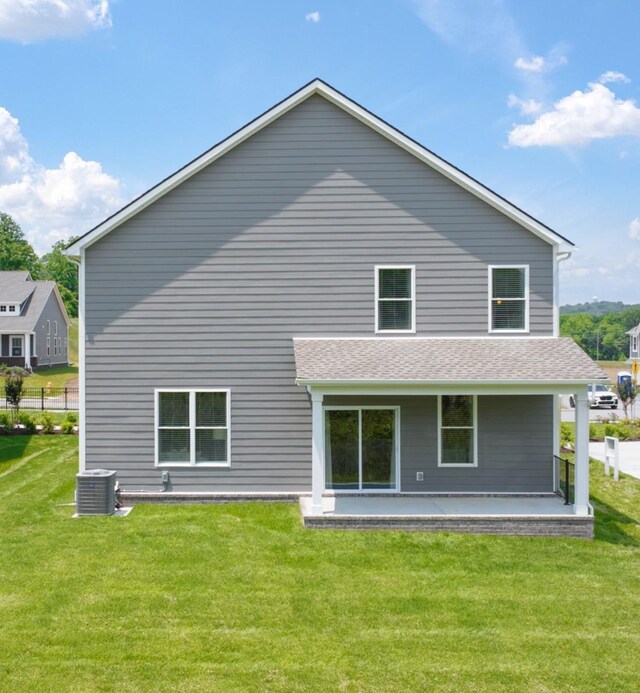 2415 Williams Ridge Dr, Columbia, TN 38401 - back of property featuring a lawn and cooling unit