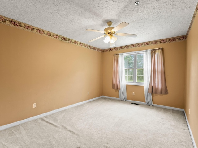 1611 Lincoln St W, Tullahoma, TN 37388 - unfurnished room featuring ceiling fan, light carpet, fire sprinkler in ceiling, and a textured ceiling