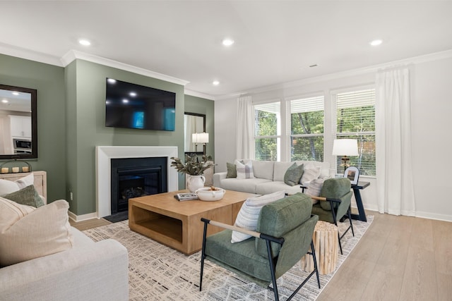 2456 Williams Ridge Dr, Columbia, TN 38401 - living area featuring crown molding, recessed lighting, light wood-style flooring, and a fireplace with flush hearth