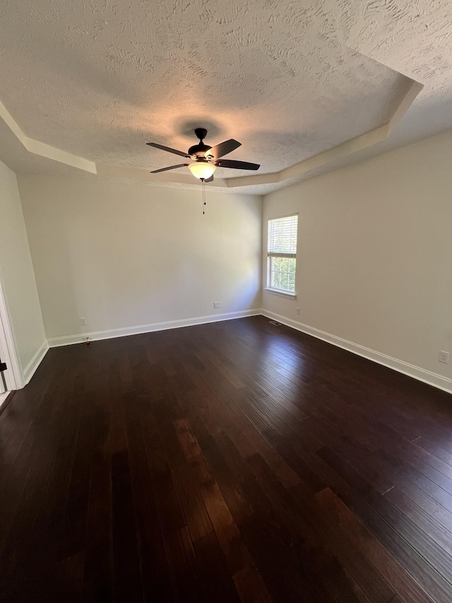 2124 Skyglen Trce, Antioch, TN 37013 - empty room featuring a textured ceiling, dark wood-type flooring, ceiling fan, and baseboards