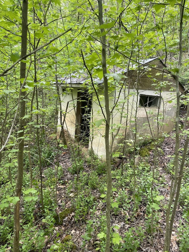 8861 Aunt Helen Rd, Silver Point, TN 38582 - view of side of home with an outbuilding and stucco siding