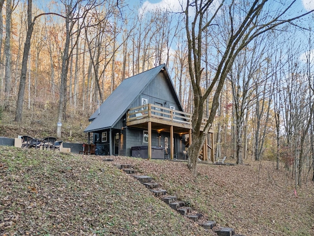 8861 Aunt Helen Rd, Silver Point, TN 38582 - view of front facade with a covered hot tub, metal roof, and a deck