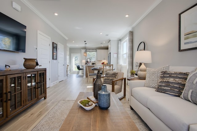 5221 Gladecress Ln, Hermitage, TN 37076 - living area featuring light wood-style floors, recessed lighting, crown molding, and baseboards