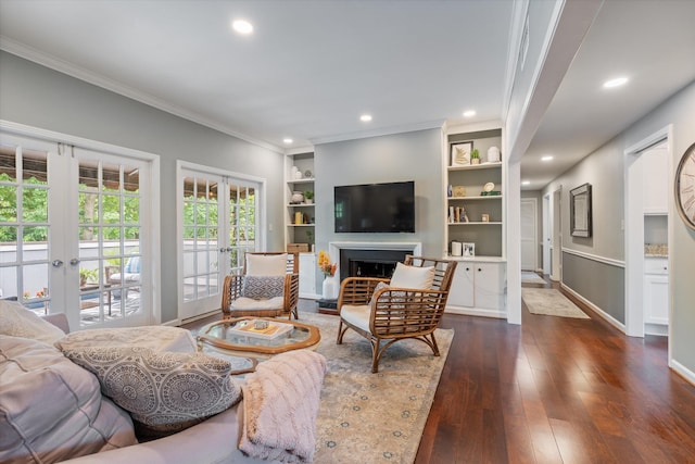 4505 Harding Pike Unit 103, Nashville, TN 37205 - living room with french doors, dark wood-style floors, ornamental molding, a fireplace, and recessed lighting
