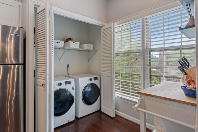 4505 Harding Pike Unit 103, Nashville, TN 37205 - laundry area with dark wood-type flooring, washing machine and dryer, and baseboards