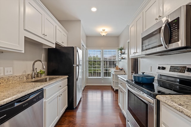 4505 Harding Pike Unit 103, Nashville, TN 37205 - kitchen featuring stainless steel appliances, a sink, dark wood-style floors, white cabinetry, and light stone countertops