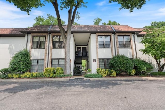 4505 Harding Pike Unit 103, Nashville, TN 37205 - townhome / multi-family property with stairs and stucco siding