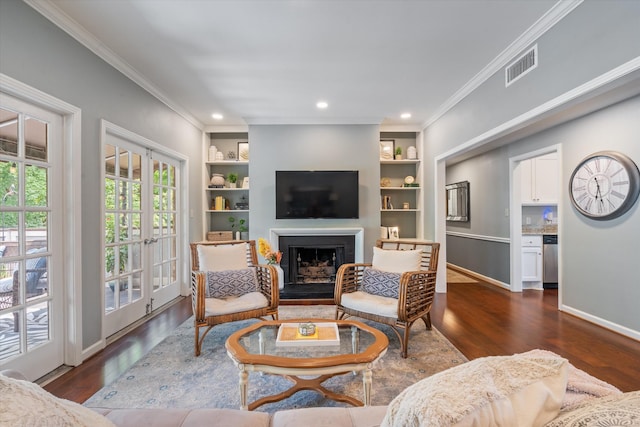 4505 Harding Pike Unit 103, Nashville, TN 37205 - living area with dark wood finished floors, crown molding, a fireplace, built in features, and baseboards