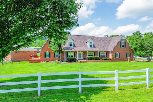 1446 Kittrell Rd, Franklin, TN 37064 - cape cod home featuring covered porch, brick siding, and a fenced front yard