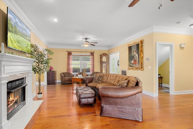 1446 Kittrell Rd, Franklin, TN 37064 - living room featuring a ceiling fan, a fireplace with flush hearth, ornamental molding, light wood-style floors, and recessed lighting