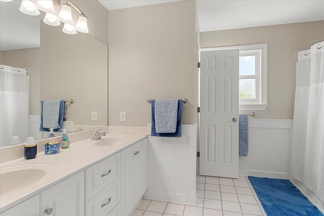 1446 Kittrell Rd, Franklin, TN 37064 - full bathroom featuring wainscoting, double vanity, tile patterned flooring, and a shower with shower curtain