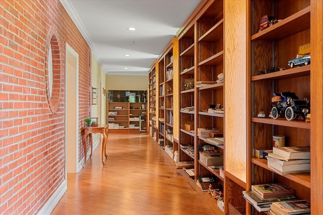 1446 Kittrell Rd, Franklin, TN 37064 - wine cellar featuring ornamental molding, wood finished floors, brick wall, and recessed lighting