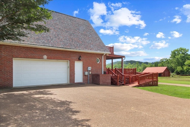 1446 Kittrell Rd, Franklin, TN 37064 - view of side of property with driveway, brick siding, a garage, and roof with shingles