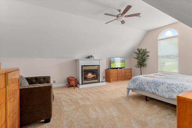 1446 Kittrell Rd, Franklin, TN 37064 - bedroom with vaulted ceiling, light colored carpet, a glass covered fireplace, and a ceiling fan