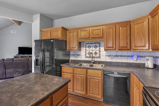 3606 Fairway Fields Ln, Spring Hill, TN 37174 - kitchen with black appliances, a sink, dark countertops, tasteful backsplash, and open floor plan