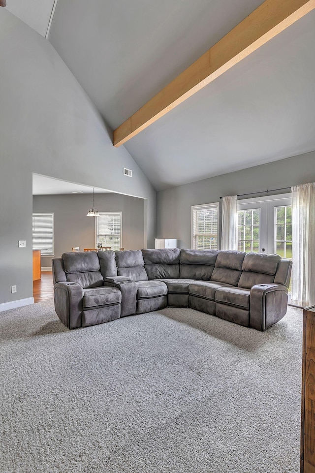3606 Fairway Fields Ln, Spring Hill, TN 37174 - carpeted living room featuring beam ceiling, a chandelier, high vaulted ceiling, and baseboards