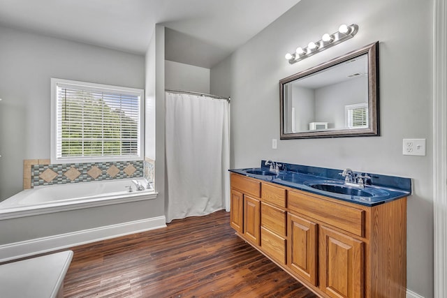 3606 Fairway Fields Ln, Spring Hill, TN 37174 - bathroom featuring double vanity, wood finished floors, a bath, and curtained shower