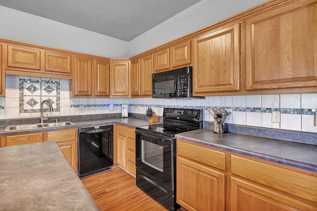 3606 Fairway Fields Ln, Spring Hill, TN 37174 - kitchen featuring black appliances, a sink, tasteful backsplash, and dark countertops