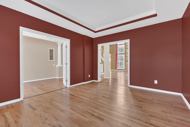2005 Dunedin Cv, Old Hickory, TN 37138 - spare room featuring decorative columns, light wood finished floors, baseboards, and crown molding