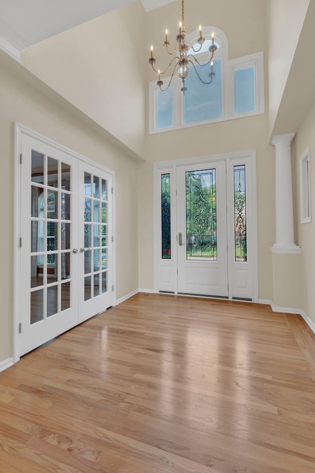 2005 Dunedin Cv, Old Hickory, TN 37138 - entryway featuring healthy amount of natural light, light wood-style floors, a chandelier, french doors, and a high ceiling