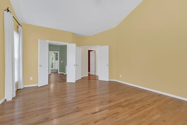 2005 Dunedin Cv, Old Hickory, TN 37138 - unfurnished bedroom featuring light wood-type flooring, baseboards, and lofted ceiling