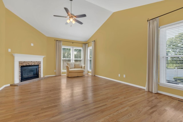 2005 Dunedin Cv, Old Hickory, TN 37138 - unfurnished living room featuring lofted ceiling, ceiling fan, light wood finished floors, a fireplace, and baseboards