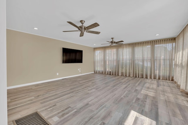 2005 Dunedin Cv, Old Hickory, TN 37138 - unfurnished living room with healthy amount of natural light, a ceiling fan, baseboards, wood finished floors, and recessed lighting