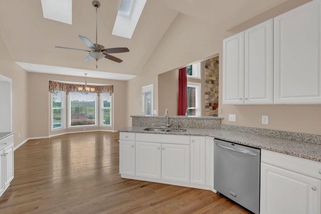2005 Dunedin Cv, Old Hickory, TN 37138 - kitchen featuring dishwasher, a sink, a peninsula, light wood-style flooring, and a skylight
