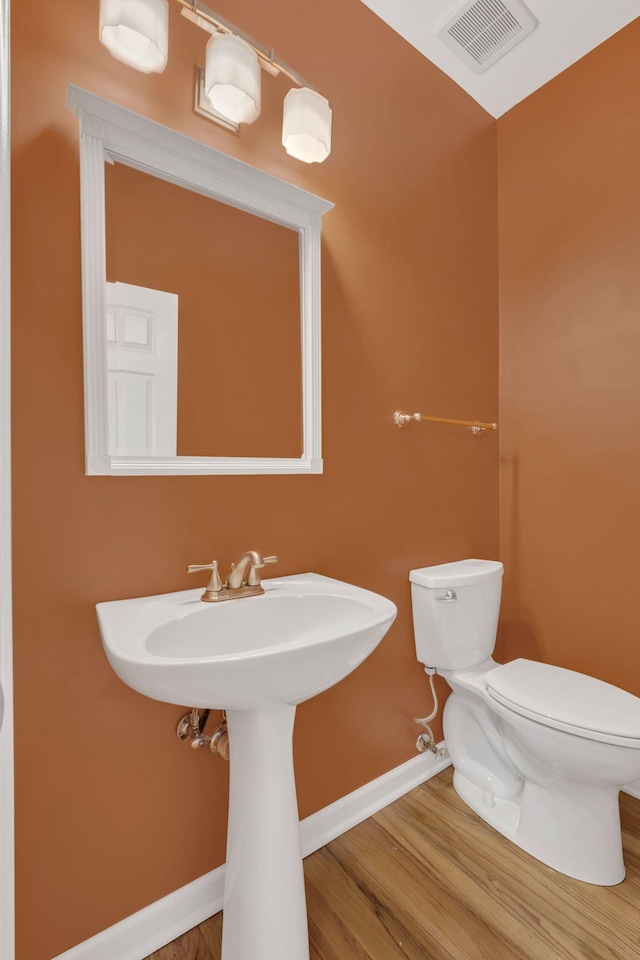 2005 Dunedin Cv, Old Hickory, TN 37138 - bathroom with toilet, baseboards, wood finished floors, and a sink