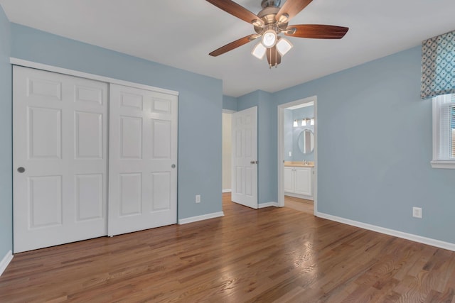2005 Dunedin Cv, Old Hickory, TN 37138 - unfurnished bedroom featuring baseboards, a closet, wood finished floors, and connected bathroom