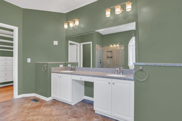 2005 Dunedin Cv, Old Hickory, TN 37138 - full bath with double vanity, baseboards, a shower, and stone finish floors