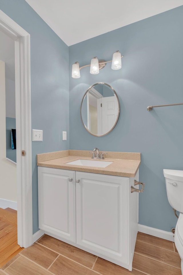 2005 Dunedin Cv, Old Hickory, TN 37138 - bathroom with toilet, vanity, wood finished floors, and baseboards