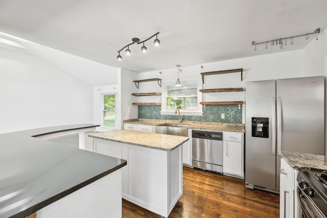 1306 Maymont Dr, Murfreesboro, TN 37130 - kitchen with stainless steel appliances, open shelves, a sink, rail lighting, and lofted ceiling