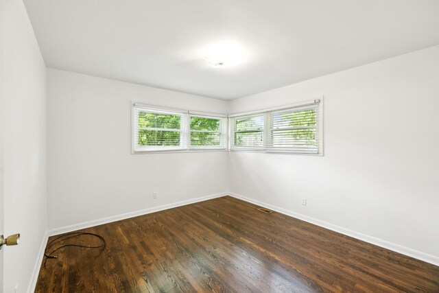 1306 Maymont Dr, Murfreesboro, TN 37130 - empty room featuring baseboards and dark wood-style floors