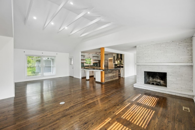 1306 Maymont Dr, Murfreesboro, TN 37130 - unfurnished living room with dark wood-style flooring, a fireplace, a sink, and recessed lighting