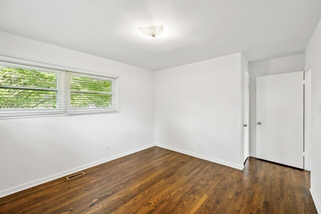 1306 Maymont Dr, Murfreesboro, TN 37130 - spare room with baseboards and dark wood-style floors