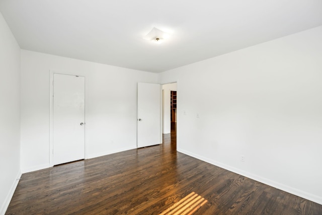 1306 Maymont Dr, Murfreesboro, TN 37130 - unfurnished bedroom with dark wood-type flooring, baseboards, and a closet