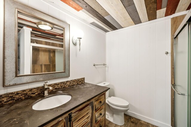 1306 Maymont Dr, Murfreesboro, TN 37130 - full bathroom featuring vanity, toilet, a shower stall, and wood finished floors